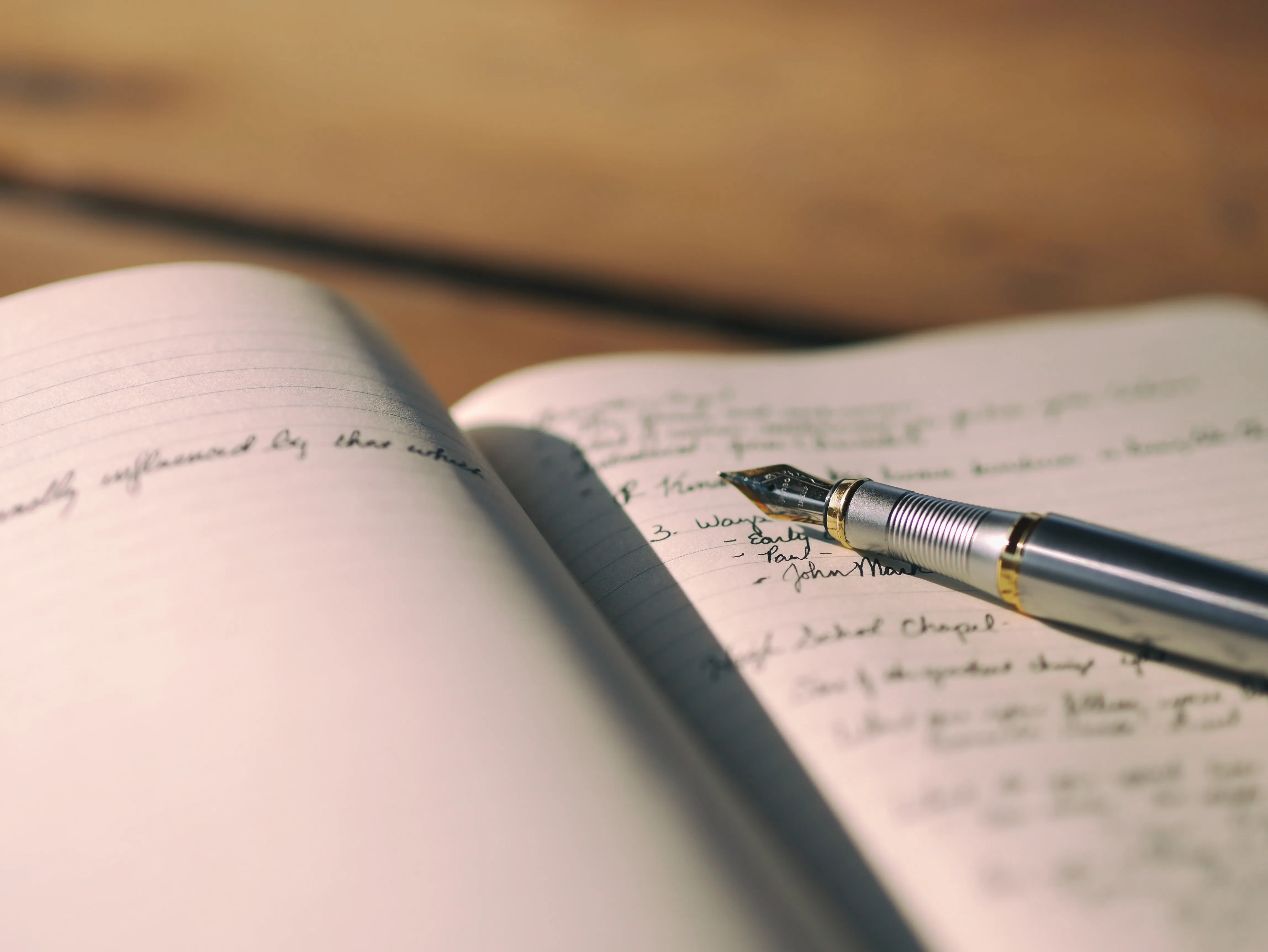Photo of journal, pencil, and writing
